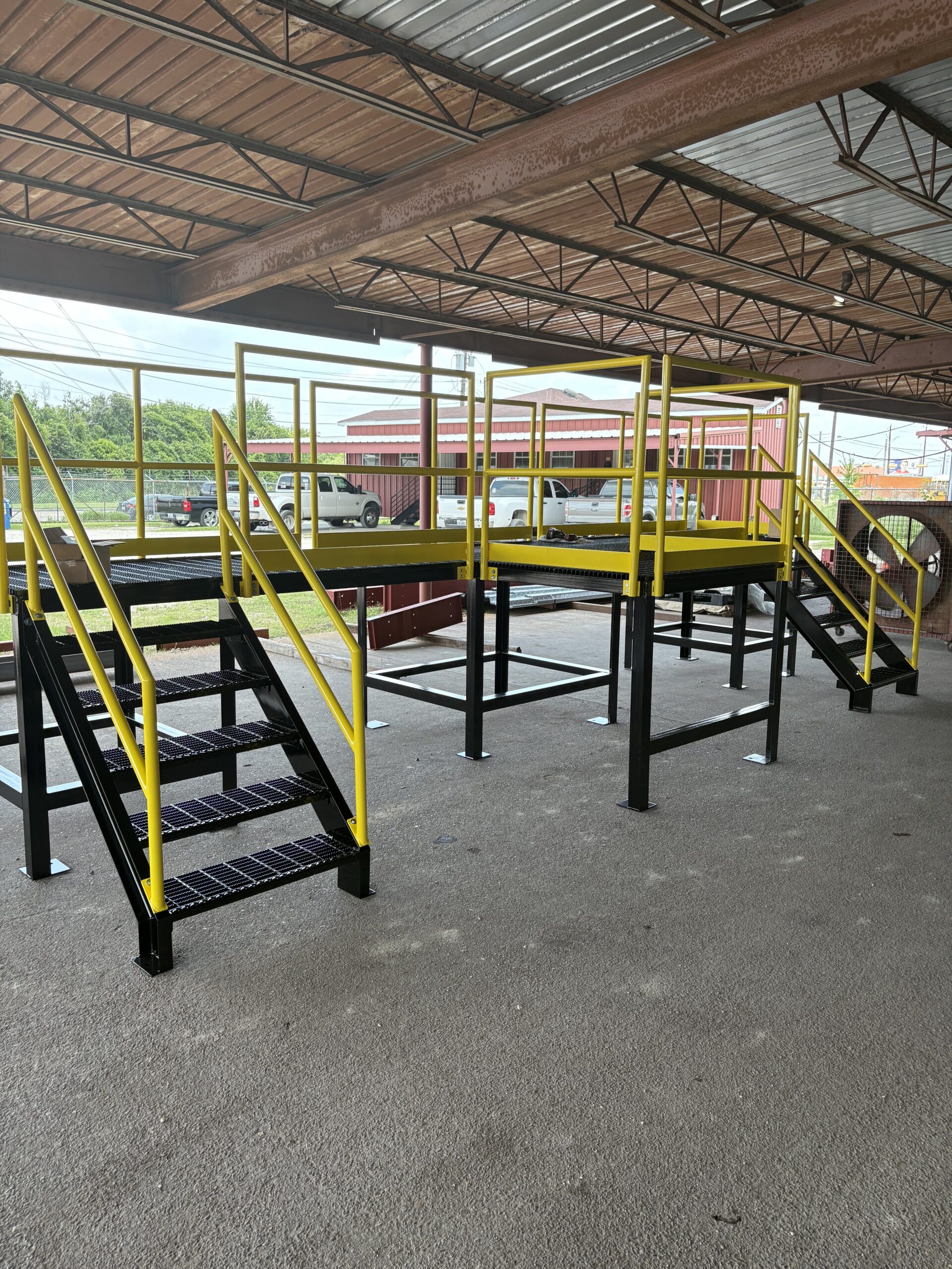 Custom steel mezzanine platform fabricated and installed at commercial facility near Houston Texas