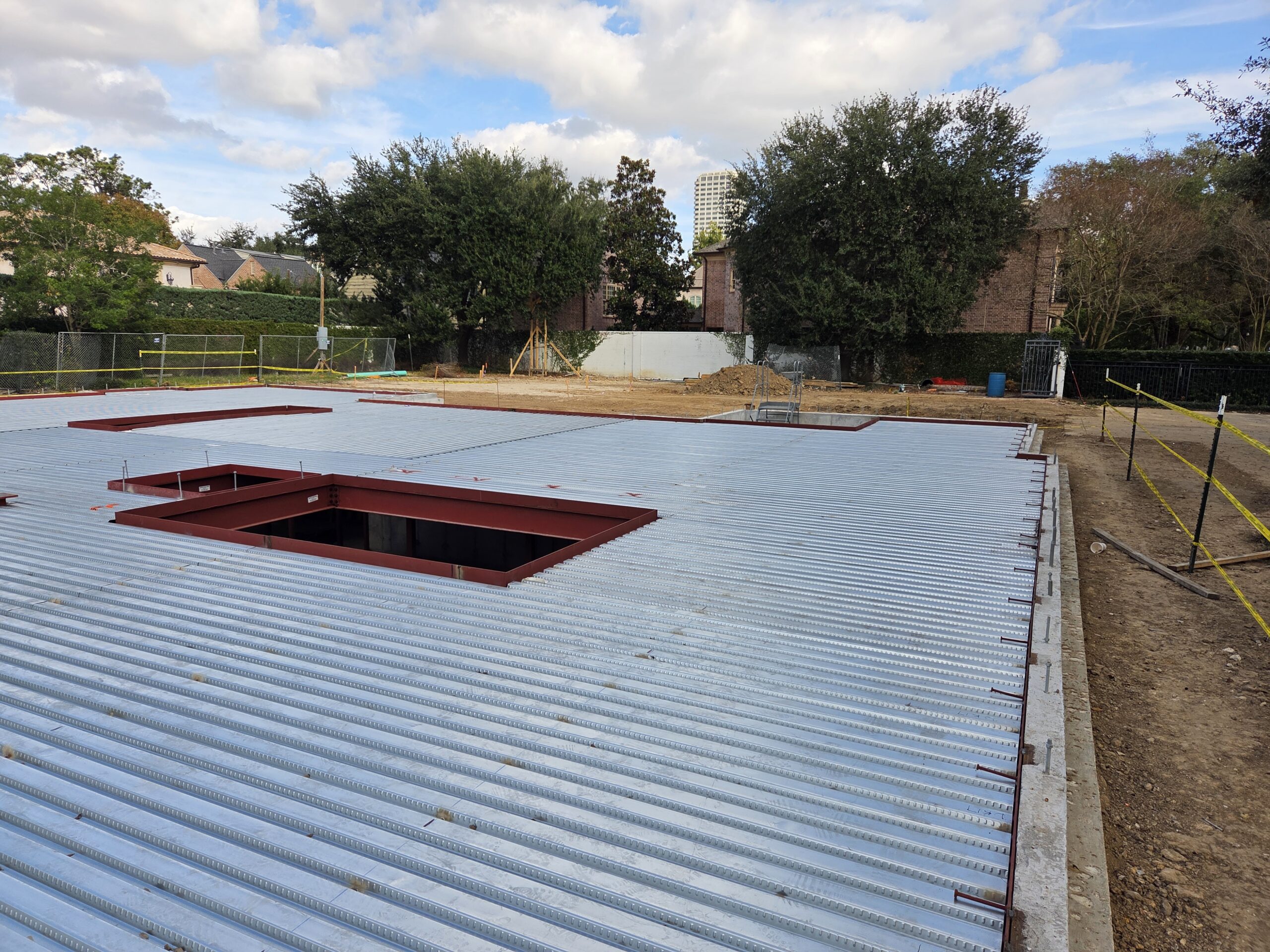 Structural steel delivery and installation crew on Houston job site